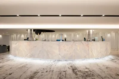 a lobby with a large marble counter in a room at Hotel Alto Lido in Funchal