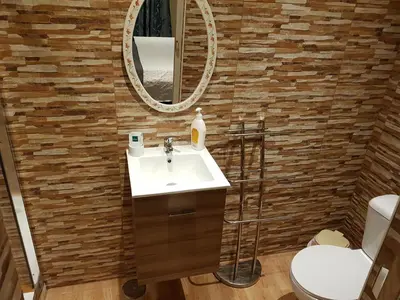 a bathroom with a sink and a mirror at Ocean View Lagos in Lagos