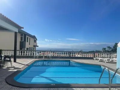 a swimming pool with a view of the ocean at Valhalla Panorama in Funchal