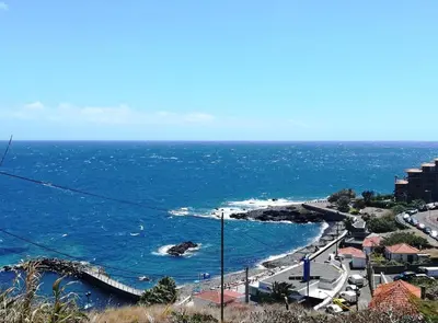 a view of a beach with the ocean at Apartamento Reis Magos in Caniço