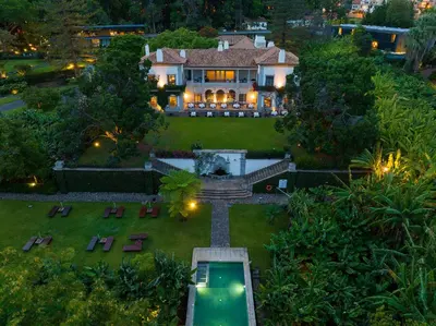 an aerial view of a house with a fountain in the yard at Quinta da Casa Branca - Small Luxury Hotels of the World in Funchal
