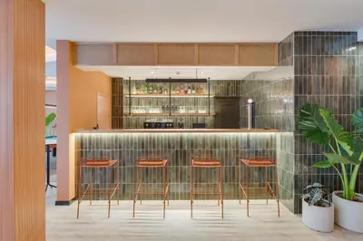 a kitchen with a bar with stools at The Editory Garden Carmo Funchal in Funchal