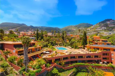 an aerial view of a resort with a pool at Quinta Splendida Wellness & Botanical Garden in Caniço
