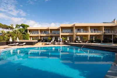 a large swimming pool in front of a building at Vila Luz in Luz