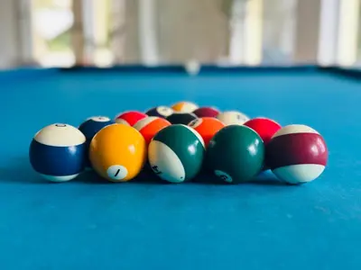 a group of billiard balls on a pool table at Vila Luz in Luz