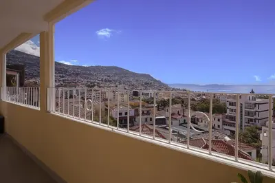 a balcony with a view of a city at Funchal Window by Homie in Funchal