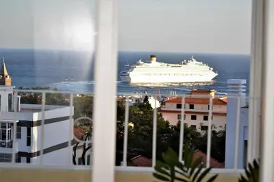a cruise ship in the ocean viewed from a window at Funchal Window by Homie in Funchal