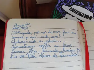 a letter written in handwriting in a notebook at Funchal Window by Homie in Funchal