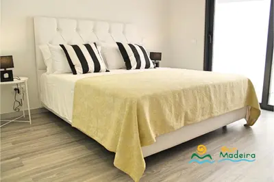 a villa with a swimming pool and a house at OurMadeira - Calheta Charm in Calheta