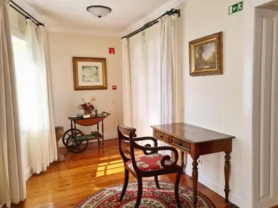a room with a desk and a chair in it at Villa Alto Boutique Hotel in Ponta do Sol