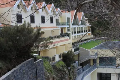 a building on the side of a mountain at Eira do Serrado - Hotel & Spa in Curral das Freiras