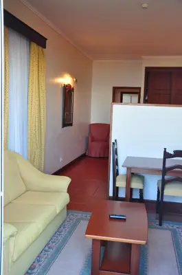 a living room with a couch and a table at Vila Marta in Funchal