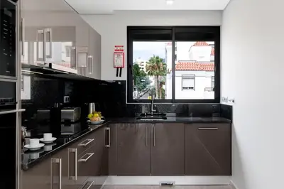 a kitchen with a sink and a window at Funchal Lux I by An Island Apart in Funchal