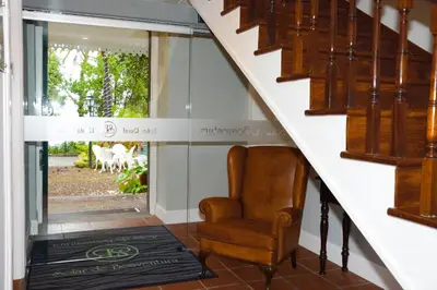 a stairway with a chair in front of a door at Solar de Boaventura in Boaventura
