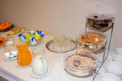 a table topped with bowls and containers of food at Solar de Boaventura in Boaventura