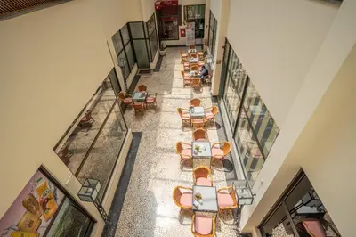 an overhead view of a restaurant with tables and chairs at Miramar Apartment with pool by Holiday Rental Madeira in Funchal