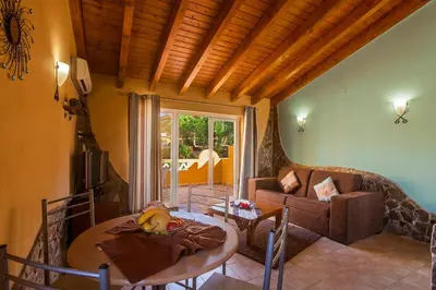 a living room with a table and a couch at Montinho De Ouro in Luz