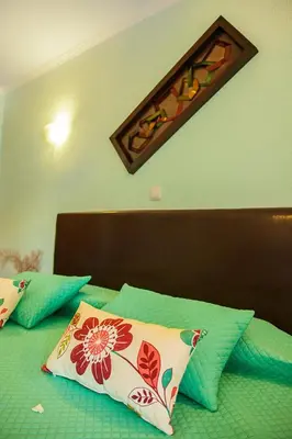 a bed with two pillows on top of it at Montinho De Ouro in Luz