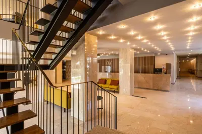 a staircase in a house with a living room at Hotel Girassol - Suite Hotel in Funchal