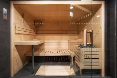 a sauna with a sink and a counter and a sink at Hotel Girassol - Suite Hotel in Funchal