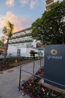 a sign in front of a building at Hotel Girassol - Suite Hotel in Funchal