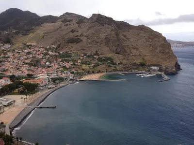 an aerial view of a beach with a mountain at Casa Miguel in Machico