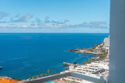 a view of the ocean from a building at Muthu Raga Madeira Hotel in Funchal
