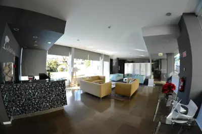 a living room with couches and chairs in a building at Madeira Bright Star by Petit Hotels in Funchal