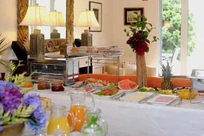 a buffet of food on a table in a room at Quinta Da Cova Do Milho in Santo da Serra