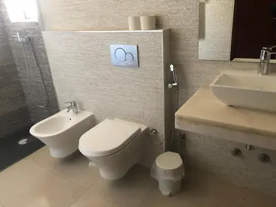 a bathroom with a toilet and a sink at Apartamentos e Quartos Atalaia in Sagres
