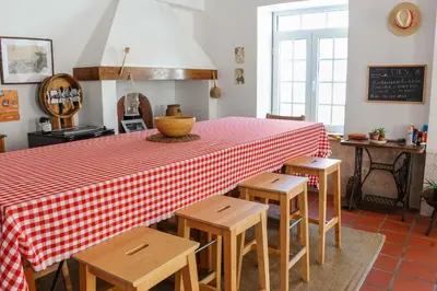 a living room with a couch and a table at Jaca Hostel Porto da Cruz in Porto da Cruz