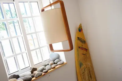 a bathroom with a mirror over a toilet at Jaca Hostel Porto da Cruz in Porto da Cruz