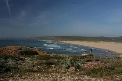 a dining room with two tables and a large window at Memmo Baleeira - Design Hotels in Sagres