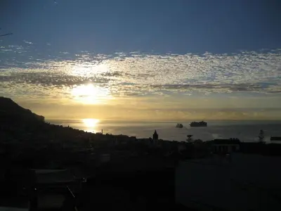 a view of the sun setting over the ocean at Colina Mar in Funchal