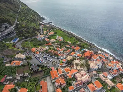 an aerial view of a town next to the ocean at Casa do Calhau in Jardim do Mar