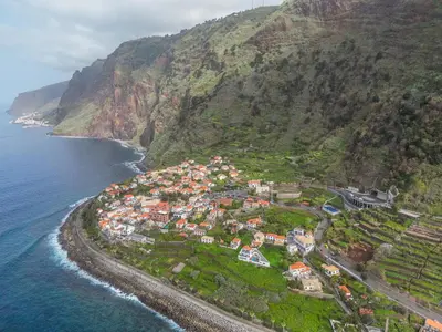 an aerial view of a village on the side of a mountain at Casa do Calhau in Jardim do Mar
