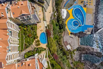 an aerial view of a resort with a swimming pool at Arcadas III by An Island Apart in Funchal