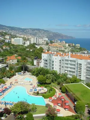 an aerial view of a resort with a swimming pool at Suite Hotel Jardins Da Ajuda in Funchal