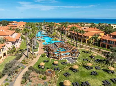 an aerial view of a resort with a pool at Pestana Porto Santo Premium All Inclusive Beach & SPA Resort in Porto Santo