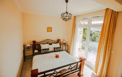 a bedroom with a bed and a balcony at Casa do Pocinho in Raposeira