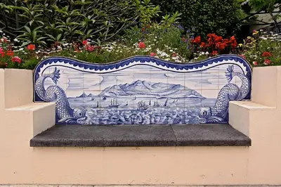 a blue and white bench sitting on a wall at OurMadeira - Casa das Vinhas in Funchal