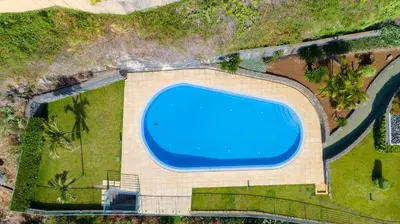 an overhead view of a swimming pool on top of a house at Zeza´s apartament in Calheta