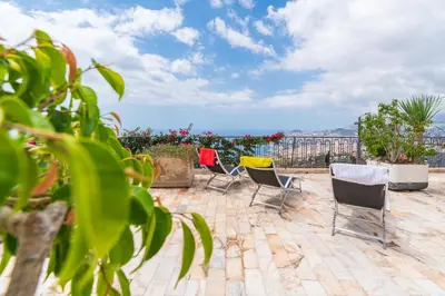 a group of chairs sitting on a patio at Casa Fatima in Funchal