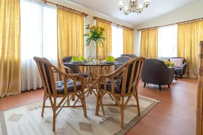 a dining room with a table and chairs at Casa Fatima in Funchal