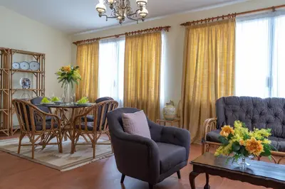 a living room with a table and chairs at Casa Fatima in Funchal