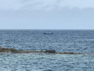 a boat in the middle of the ocean at Duplex Ocean View in Porto Santo