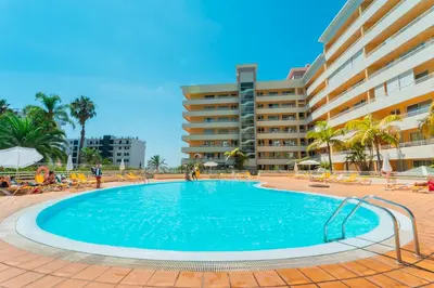 a large swimming pool in front of a hotel at FLH Funchal Green Park Apartment with Pool in Funchal