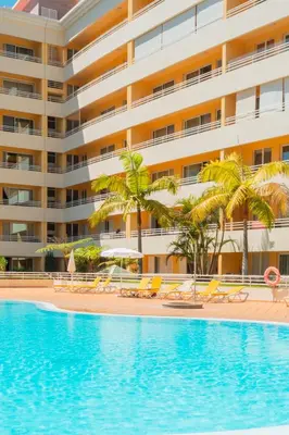 a swimming pool in front of a hotel at FLH Funchal Green Park Apartment with Pool in Funchal