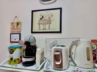 a table with a counter top with a counter top with a counter top at Sunny Little Sister Apartment - 7 min walking from the beach and at 7 min driving from the Airport in Machico