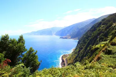 a view of the ocean from a mountain at Refúgio da Ribeira in Porto Moniz